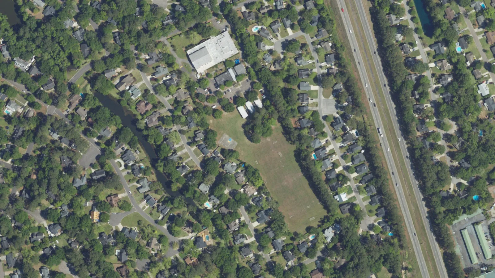The 6.5-acre tract on Wakendaw Road, the open field at center, seen from the air.