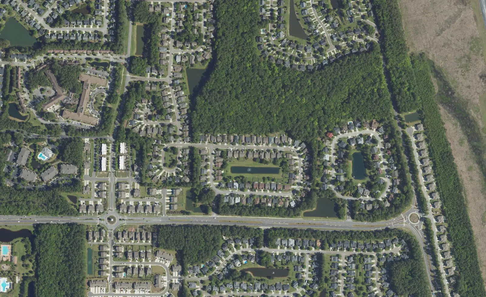Aerial view of Park West in Mount Pleasant, with Park West Boulevard and its roundabouts crossing the neighborhoods.