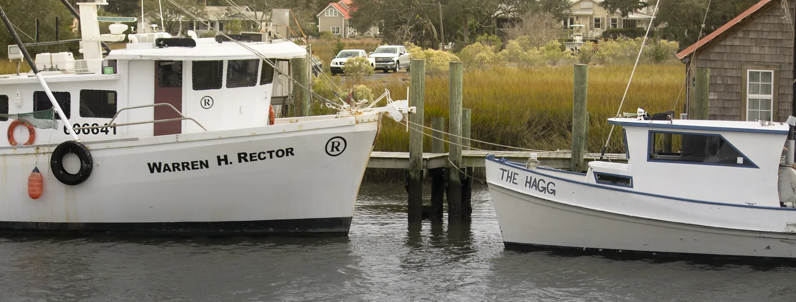 Shrimp boats tied up on Shem Creek in Mount Pleasant, where several waterfront restaurants on this list have outdoor seating.