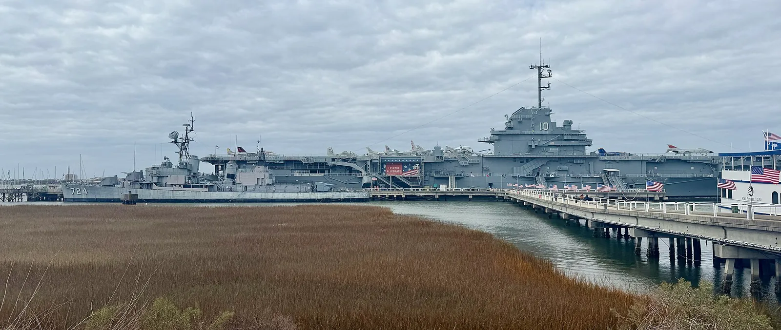 The destroyer USS Laffey and the aircraft carrier USS Yorktown at Patriots Point in Mount Pleasant, seen across the marsh.